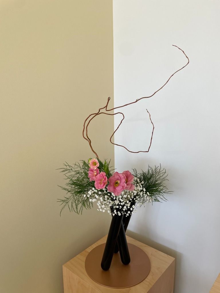 Ikebana arrangement with layered flowers