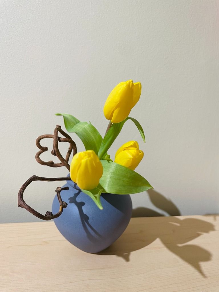 Contemporary ikebana arrangement with dynamic lines