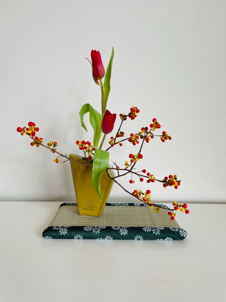 Minimal ikebana arrangement with focused branch placement