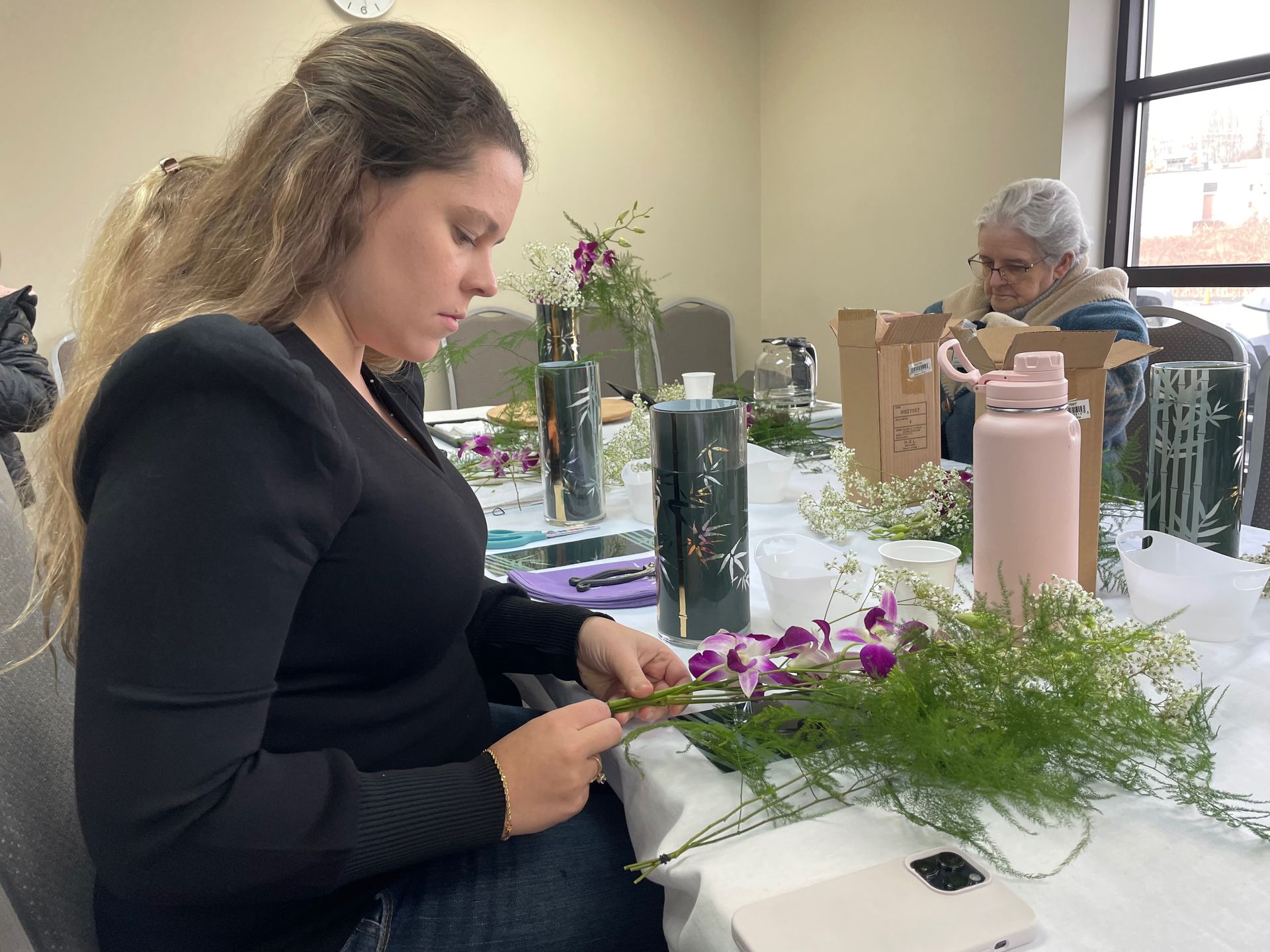 Students working on ikebana arrangements