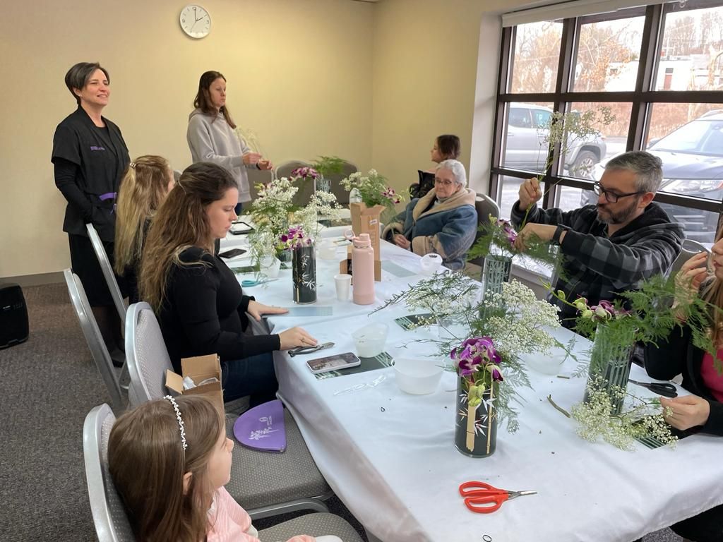 Students practicing ikebana during class