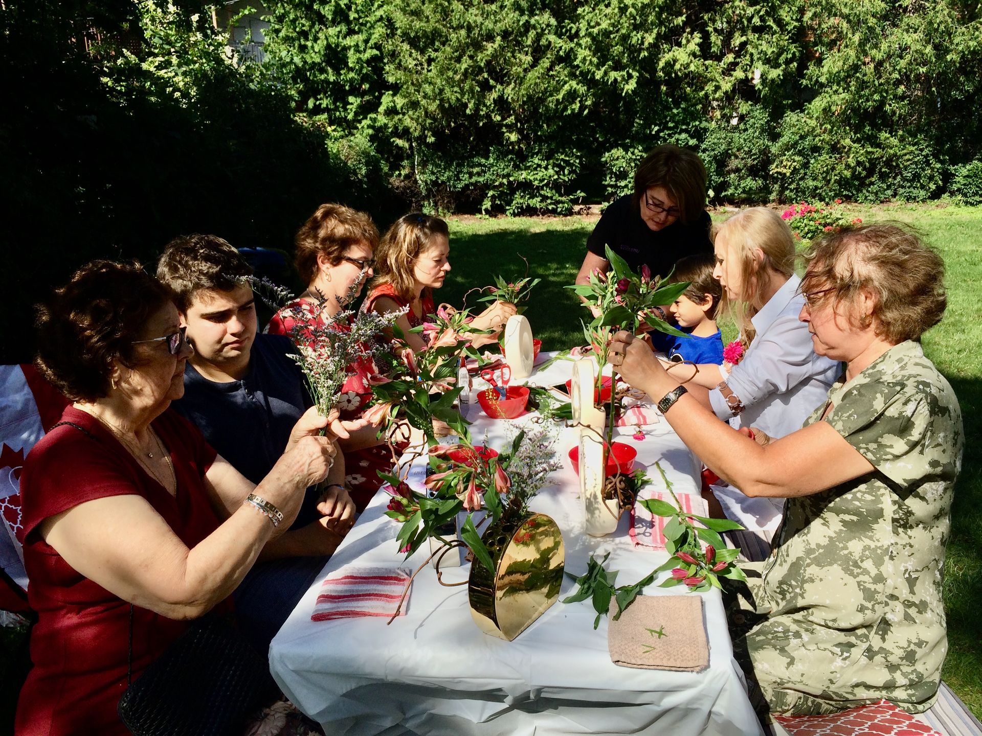 Participants practicing ikebana during a workshop